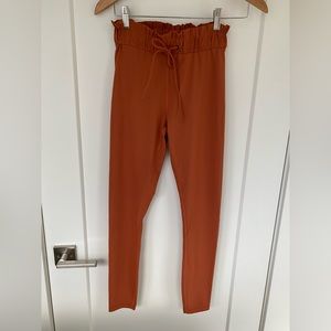 Titika Couture Athlectic tights. Rust colour size Small